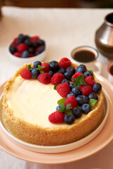 Cheesecake with berries on a white background. Side view.