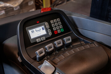 Electric forklift buttons and control panel close up view. Detail image of driving control of warehouse inventory