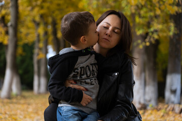 Mother and baby love on autumn sunny day