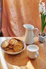 Honey oatmeal chip cookies. Side view. Milk.