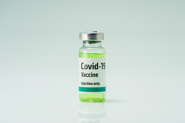 Covid 19 coronavirus vaccine in glass flask for immunity