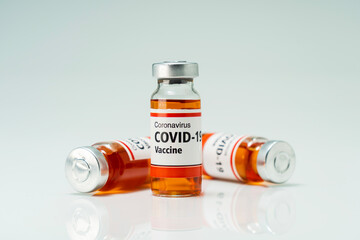 Covid 19 coronavirus vaccine in glass flask for immunity