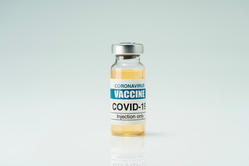 Covid 19 coronavirus vaccine in glass flask for immunity