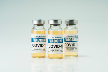 Covid 19 coronavirus vaccine in glass flask for immunity