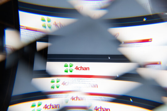 Milan, Italy - APRIL 10, 2021: 4CHAN logo on laptop screen seen through an optical prism. Dynamic and unique image from 4CHAN website. Illustrative editorial.