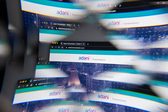 Milan, Italy - APRIL 10, 2021: Adani Transmission logo on laptop screen seen through an optical prism. Dynamic and unique image from Adani Transmission website. Illustrative editorial.