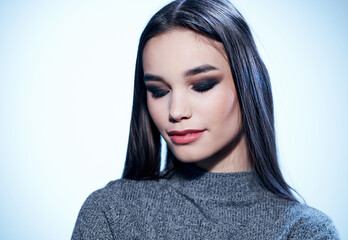 Naklejka premium Delightful woman portrait with brunette makeup cropped view light background