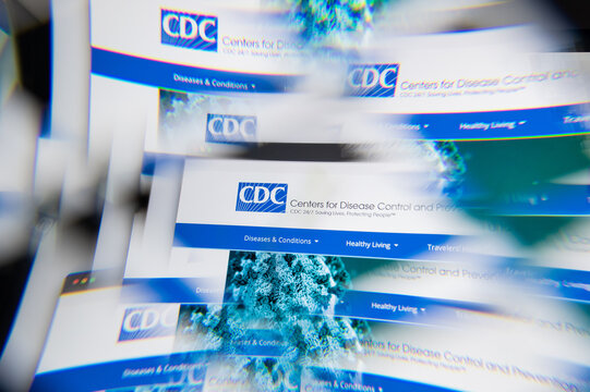 Milan, Italy - APRIL 10, 2021: CDC logo on laptop screen seen through an optical prism. Illustrative editorial image from CDC website.