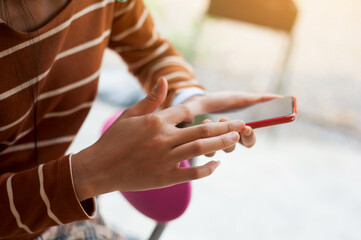 Close-up of a woman using a smartphone.