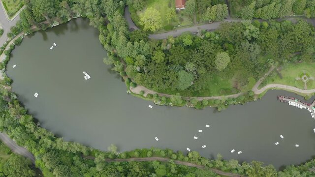aerial image with drone mavic 2 pro from Lago Negro in Gramado Rio Grande do sul Brazil with pedal boats and trees around