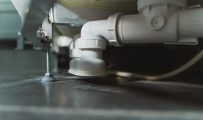 Close-up view of plastic bath trap.