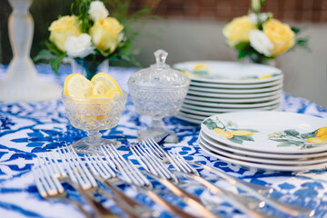 Elegant summer themed table setting for outdoor wedding