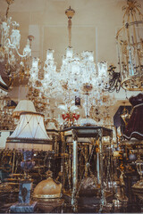 Lots of glowing crystal chandeliers and lamps. Vertical