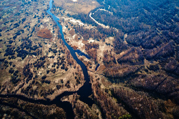 Fototapeta na wymiar Overflowing river in the valley, aerial view