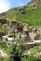 Fototapeta na wymiar ARMENIA-Geghard Monastery is an exceptional architectural construction partially carved into the rock of an adjacent mountain.