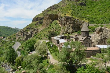 Fototapeta na wymiar ARMENIA-Geghard Monastery is an exceptional architectural construction partially carved into the rock of an adjacent mountain.