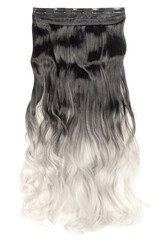 single piece of clip in wavy black to bleached blonde ombre style synthetic hair extensions © Sixsmith