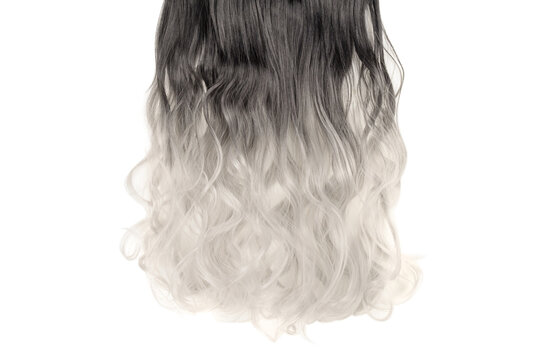 close up of single piece clip in wavy black to bleached blonde ombre style synthetic hair extensions