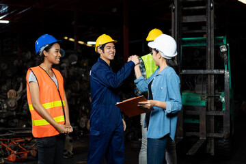 Group of diversity factory employee worker successful about work at the industry factory old garage automotive spare parts warehouse