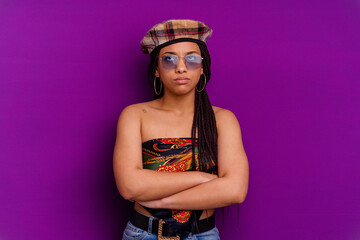 Young african american woman isolated on yellow background Young african american woman isolated on yellow background tired of a repetitive task.