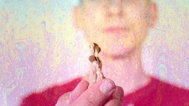 Psilocybin psychedelic microdosing. Magic Mushrooms being eaten by a casual man.