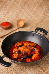 Spicy King fish curry gravy , hand cooking spicy Kerala fish curry fish vindaloo , Goan red fish curry , Indian fish curry Bengali fish masala curry Kolkata, Tamil Nadu India Sri Lanka. Lankan food