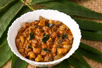 Spicy Beef and kaya curry Goan style beef vindaloo. Traditional Indian Lamb or beef curry . spicy Beef curry gravy popular in Kerala Sri Lankan Goa for Appam, Parotta porotta India. Chukhandar gosht. 