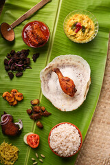 Appam with mutton stew Non-vegetarian sadhya Indian food for Onam sadya Christmas Easter celebration Kerala India Sri Lanka hoppers beef fry fish curry rice on banana leaf