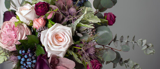 floral background. A long floral banner. Floristics. Purple and green. Colorful bouquet in cool colors.