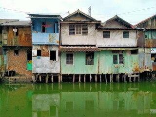 Fototapeta na wymiar Sungai Duri, Roxy mas, Jakarta, Indonesia - (04-03-2021) :The atmosphere of a densely populated settlement standing on the river bank
