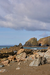 rock formations at the low tide of the beach Kilfarrasy Beach. Co.Waterford Coastline, Ireland