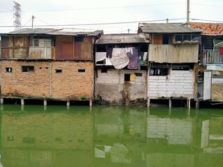 Sungai Duri, Roxy mas, Jakarta, Indonesia - (04-03-2021) :The atmosphere of a densely populated settlement standing on the river bank