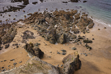 aerial view of the rocks of a beach with different shapes. Kilfarrasy Beach. Co.Waterford Coastline, Ireland