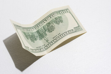 Flying 100 American dollars banknotes, isolated on white background