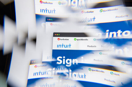 Milan, Italy - APRIL 10, 2021: Intuit Quickbooks logo on laptop screen seen through an optical prism. Illustrative editorial image from Intuit Quickbooks website.