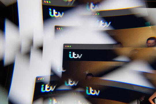 Milan, Italy - APRIL 10, 2021: ITV logo on laptop screen seen through an optical prism. Illustrative editorial image from ITV website.