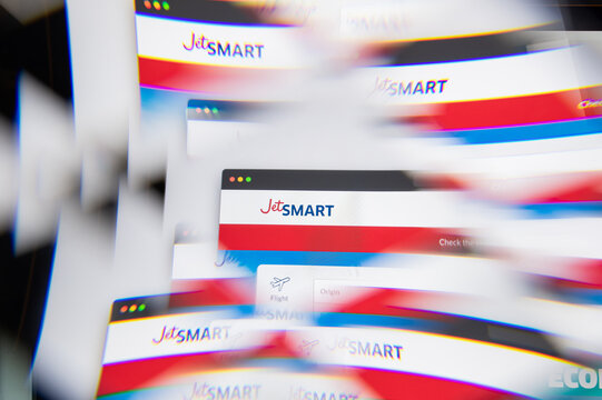 Milan, Italy - APRIL 10, 2021: JetSmart logo on laptop screen seen through an optical prism. Illustrative editorial image from JetSmart website.