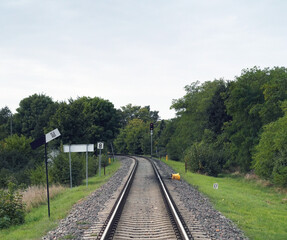 Fototapeta na wymiar Fragment of the railway. Railway crossing. Traffic lights 