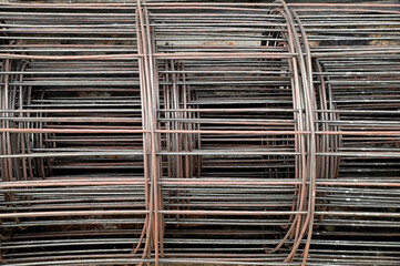 Closeup of Pile of Steel Rods or Steel Bars lay on the floor in building construction at Thailand.