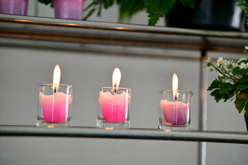 Colorful Candles in the Glasses in the church, Thailand. selective focus.