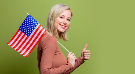 Beautiful cowgirl with United States of America flag