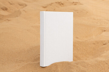 book with blank cover and empty cover perched on sandstone rock