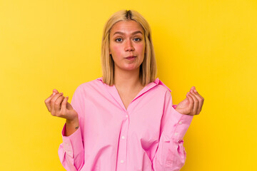 Young venezuelan woman isolated on yellow background showing that she has no money.