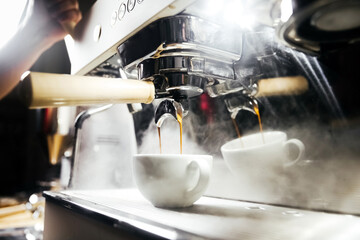 Bartender making coffee barista in a cafe
