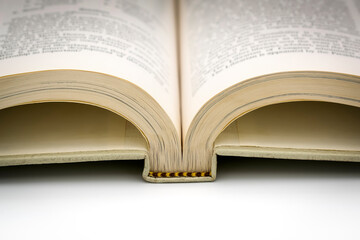 Old open encyclopedia book close-up