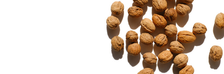 Walnuts. Seeds and nuts banner. Whole walnuts on a white background. Healthy fats. 
