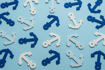 Blue anchors on a blue background.