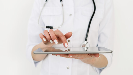 Doctor in white uniform against white background