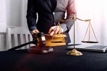 Business and lawyers discussing contract papers with brass scale on desk in office. Law, legal...