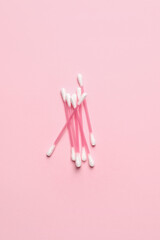 Cotton swabs on color background